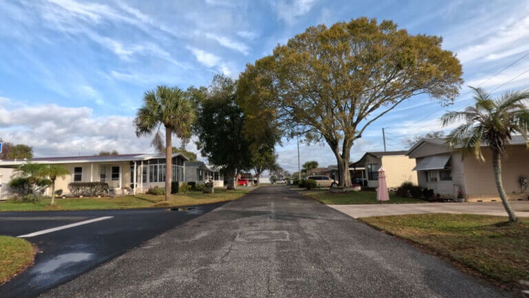 Street view of homes inside Lake Griffin Harbor Village in Leesburg, Florida.