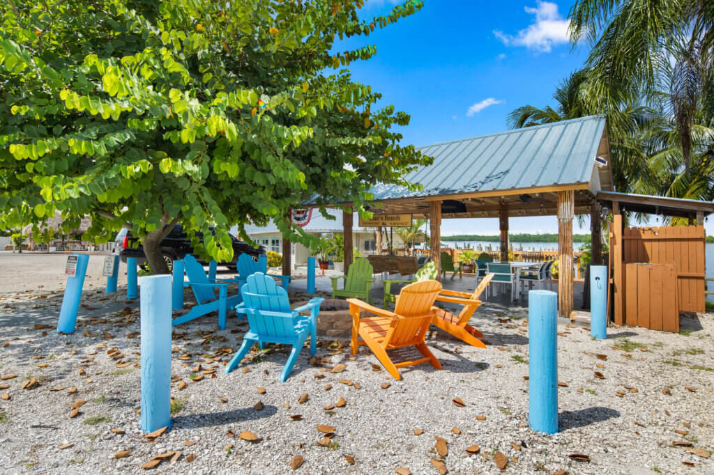 blue and orange chairs surrounding a fire pit