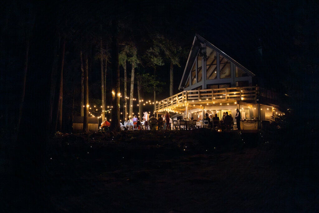 Party lights during a wedding at Island Lodge on Sebago Lake at the Point Sebago Resort in Casco, Maine. Photo by Life in Focus.