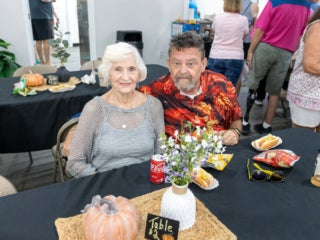 Couple enjoying complimentary food and drinks at the 2025 RGV West Clubhouse Reopening