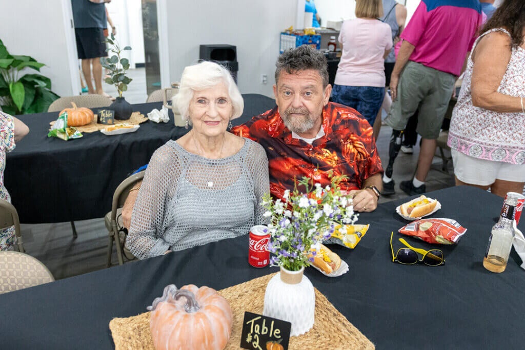 Couple enjoying complimentary food and drinks at the 2025 RGV West Clubhouse Reopening