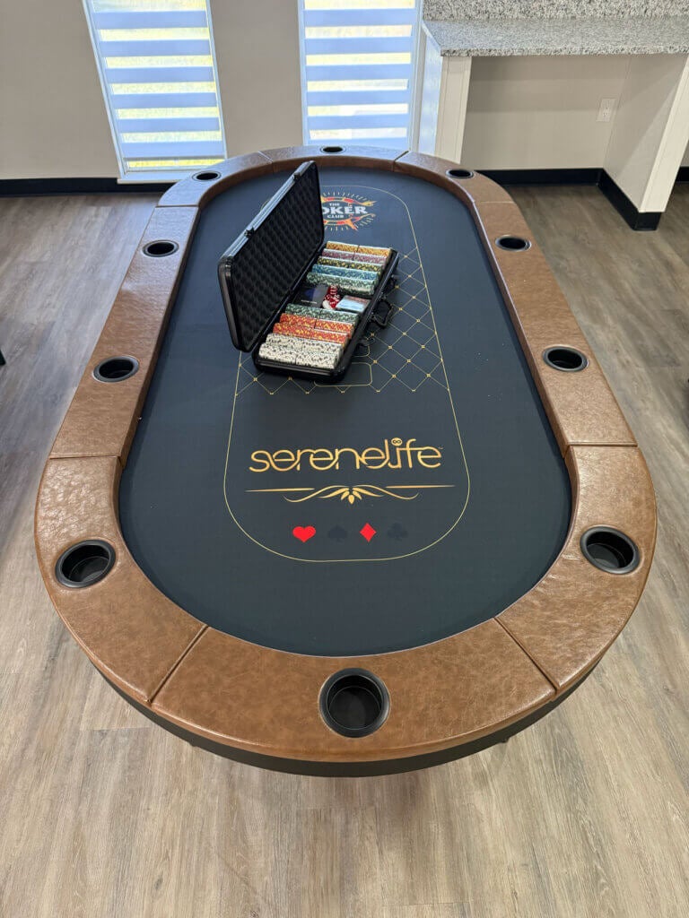 Poker table and poker chips in the fully renovated main room within the West Clubhouse at Rolling Greens Village in Ocala, Florida.