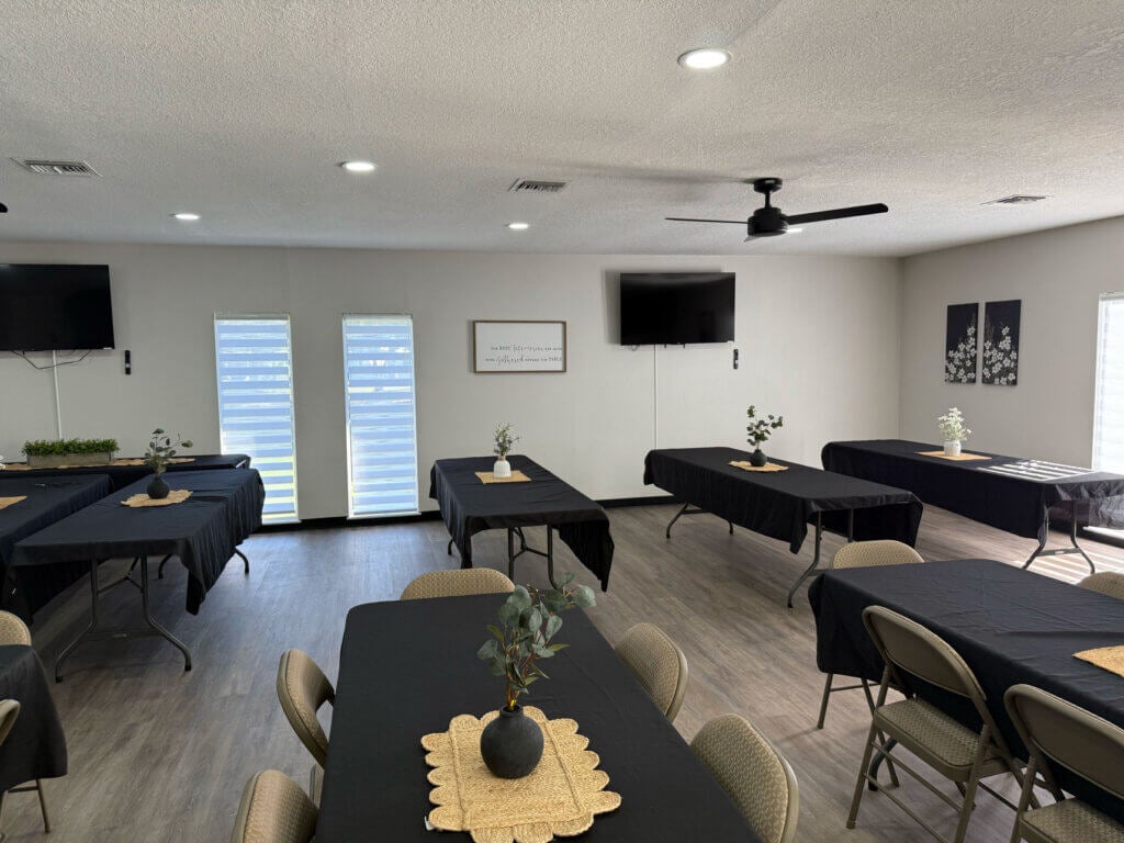 Interior view of the fully renovated main room within the West Clubhouse at Rolling Greens Village in Ocala, Florida.