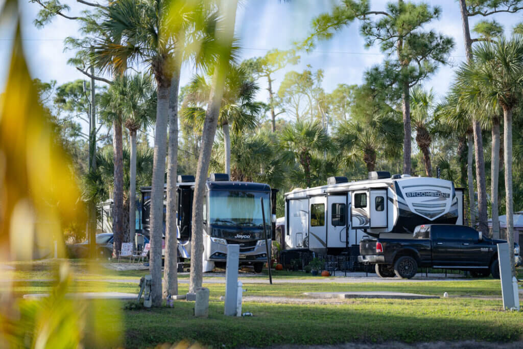 Two RV parked side-by-side at Blueway RV Park in Fort Myers, Florida.