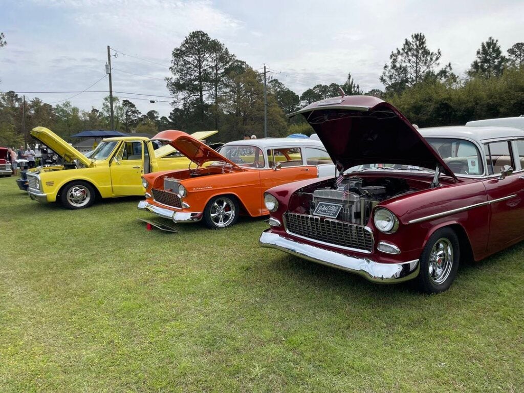 Three classic vehicles parked at the Low Country Car Club Show at CreekFire RV Resort in Savannah.