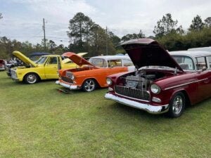 Three classic vehicles parked at the Low Country Car Club Show at CreekFire RV Resort in Savannah.
