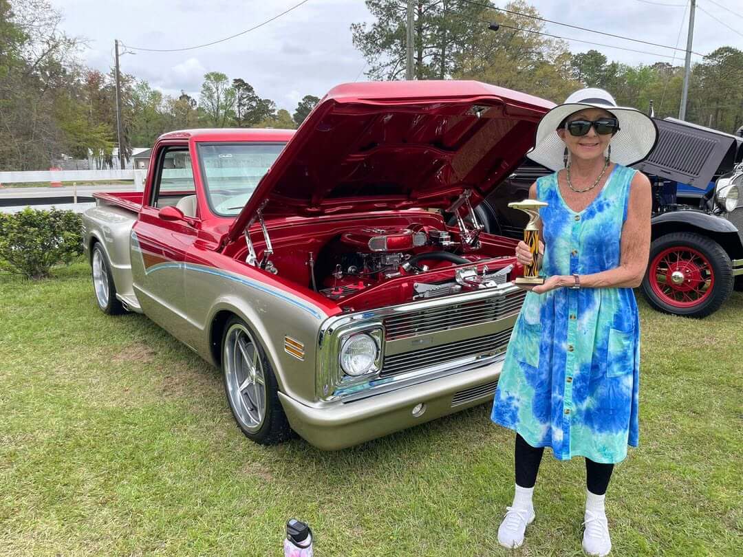 Low_Country_Car_Club_Show_Winner Truck owner showing off her trophy at the Low Country Car Club Show at CreekFire RV Resort in Savannah.