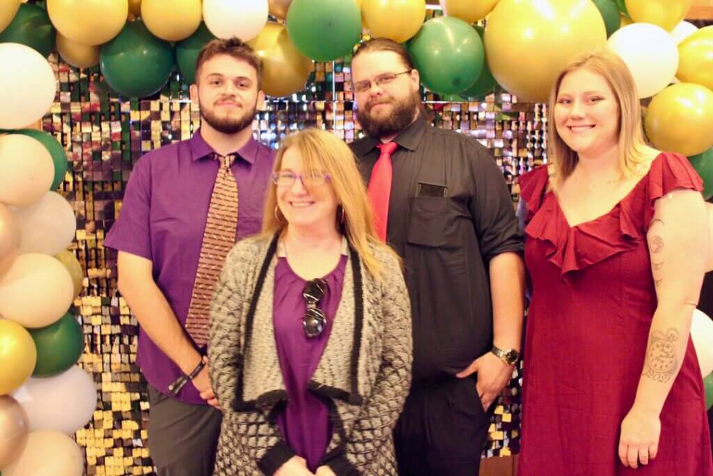 Four people posing at the Point Sebago Resort Resident&#039;s Choice Awards.