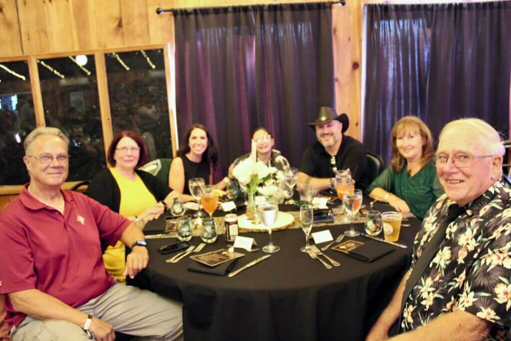 Guests sitting around a table at the Point Sebago Resort Resident&#039;s Choice Awards.