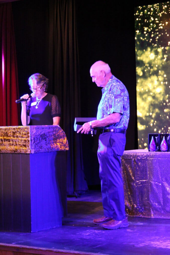 Man accepting an award at the Point Sebago Resort Resident&#039;s Choice Awards.