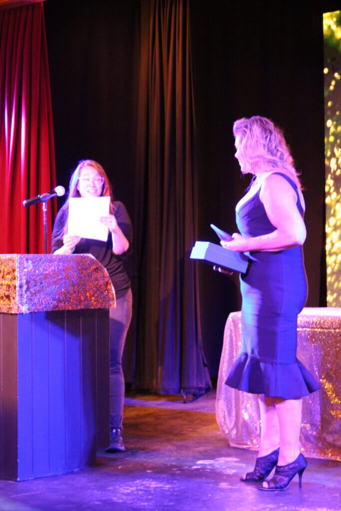 Woman accepting an award at the Point Sebago Resort Resident&#039;s Choice Awards.