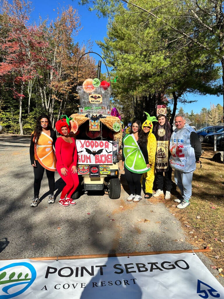 Group dressed as a the ingredients of a VooDoo Rum Bucket in the Halloween Costume Contest at Point Sebago Resort in Casco, Maine.