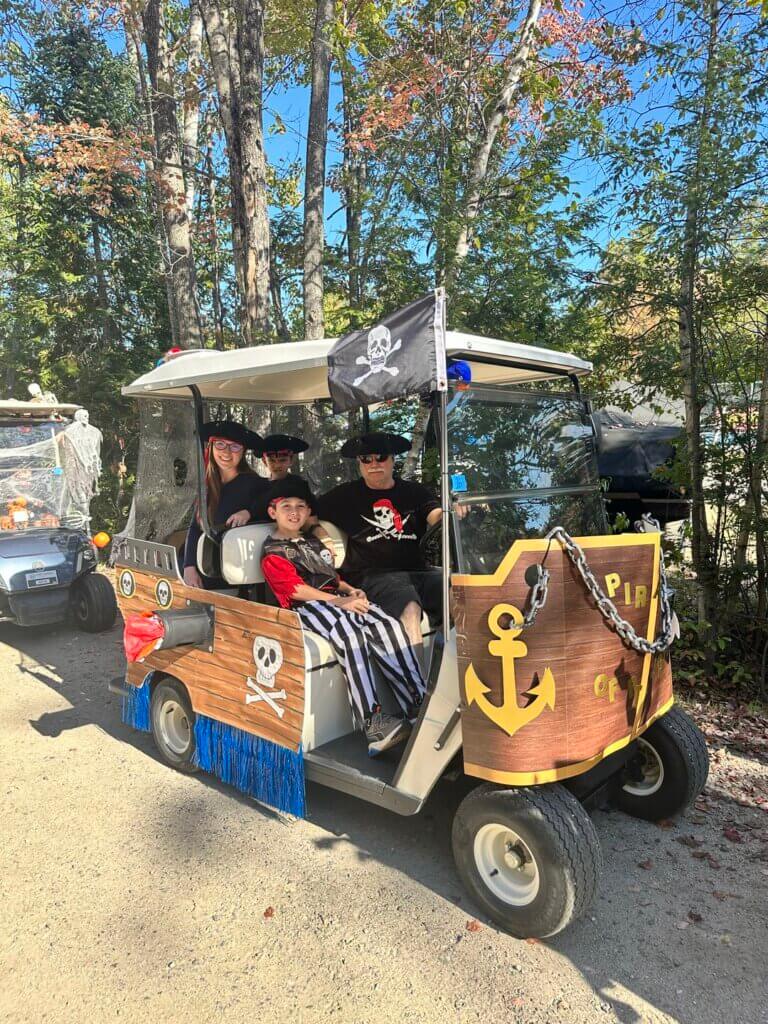 Golf cart decorated like a pirate ship for the 2025 Halloween Parade at Point Sebago Resort in Casco, Maine.