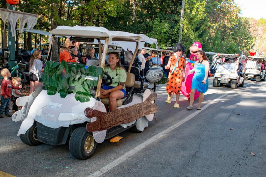 Guests dressed as the Flintstones in the Halloween Parade at Point Sebago Resort in Maine. Photo courtesy of Dave Rando Photography.