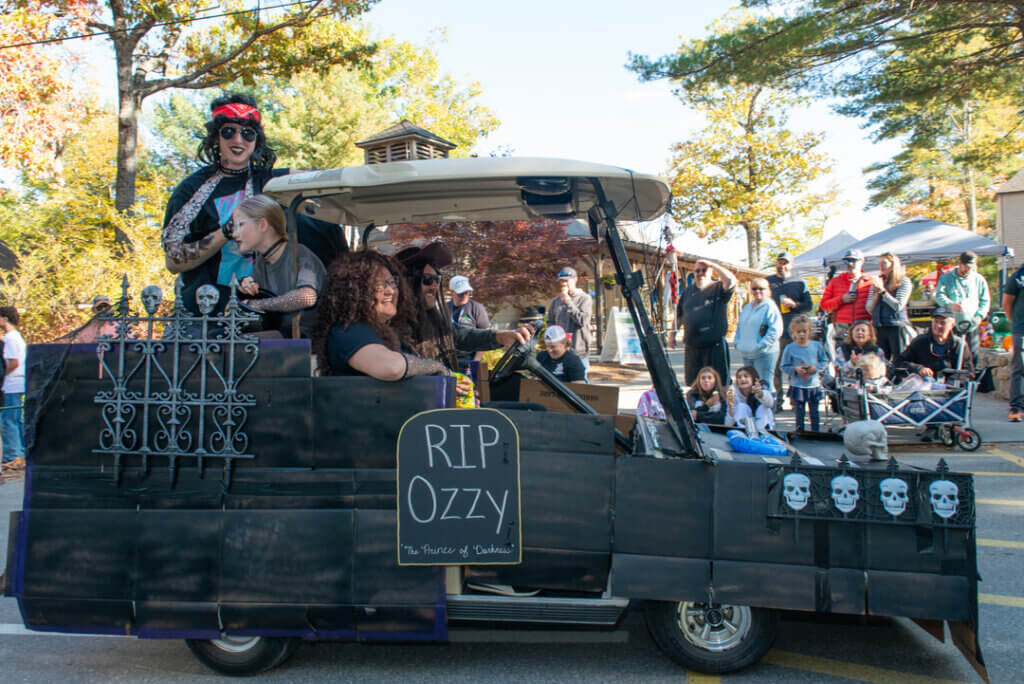 An Ozzy Osborn themed golf cart in the Halloween Parade at Point Sebago Resort in Maine. Photo courtesy of Dave Rando Photography.