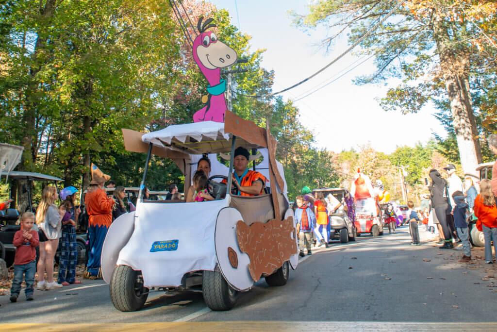 Flintstones themed golf cart in the Halloween Parade at Point Sebago Resort in Maine. Photo courtesy of Dave Rando Photography.