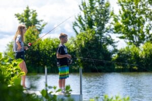 Two kids fishing on Sebago Lake in Maine