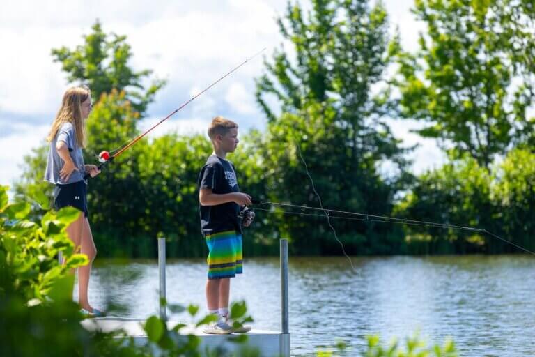 Two kids fishing on Sebago Lake in Maine