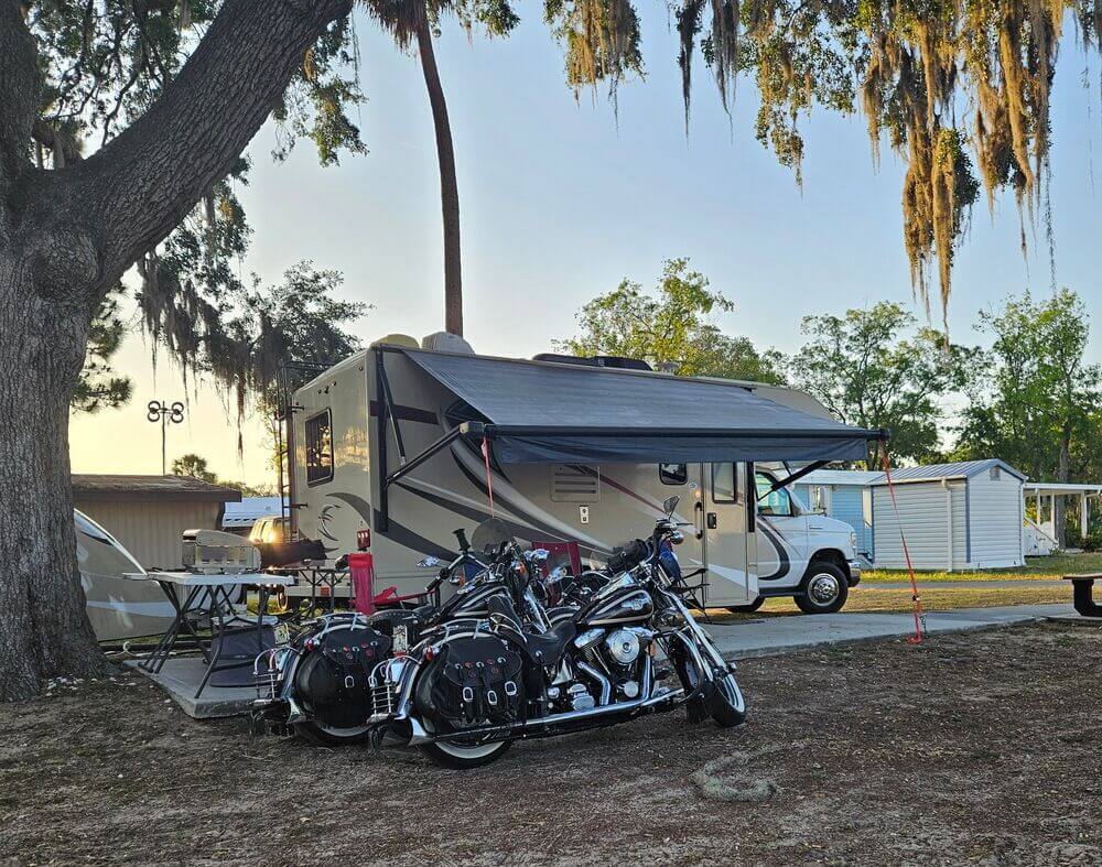 Motorcycles parked at an RV site in Holiday RV Park in Leesburg, Florida during Bikefest.