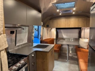 Interior of an Airstream Trade Wind travel trailer at the 2026 Florida RV SuperShow in Tampa, FL.