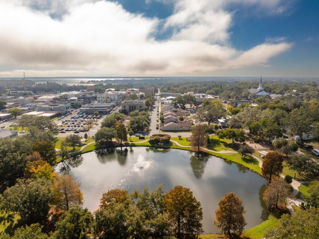Drone angle view of Leesburg, Florida, with lake, park and downtown district by Michael Warren from iStock.