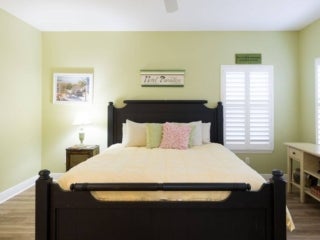 Bedroom within the vacation home guest rental in Leesburg, Florida, at Holiday RV Park.
