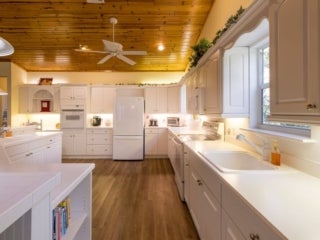 Kitchen within the vacation house rental in Leesburg, Florida, at Holiday RV Park.