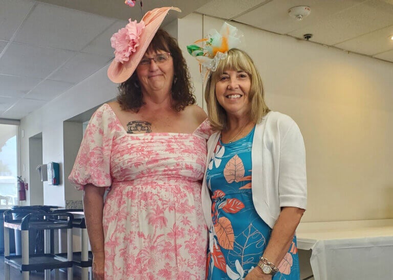 Residents from Camelot East Village in Sarasota, FL. at a high tea event in the Clubhouse.
