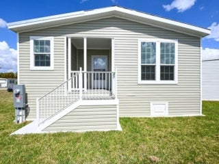 EBV - 20513 Polynesian Lp 04 Exterior of 20513 Polynesian Lp. at Estero Bay Village in Estero, Florida.