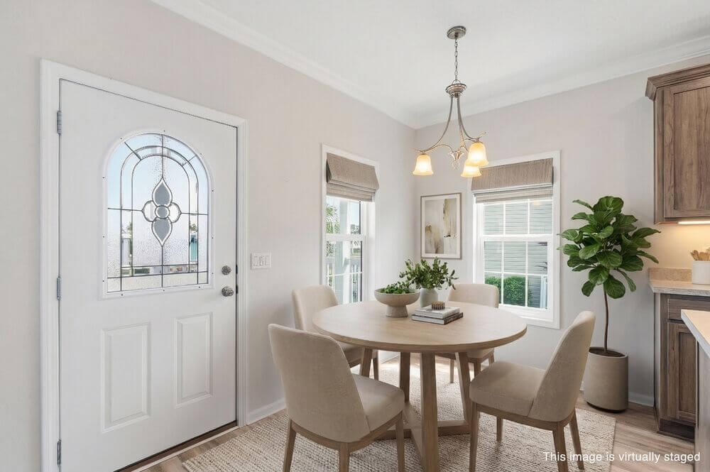 EBV-20548-Polynesian-Lp-Dining-Room-STAGED-WM Virtually staged interior of 20548 Polynesian Lp. at Estero Bay Village in Estero, Florida.