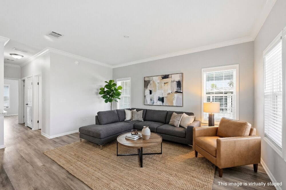 EBV-20548-Polynesian-Lp-Living-Room-STAGED-WM Virtually staged interior of 20548 Polynesian Lp. at Estero Bay Village in Estero, Florida.