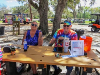Guests working the 50/50 raffle fundraiser during Hippie Fest at 55+ Holiday RV Park in Leesburg, Fl.