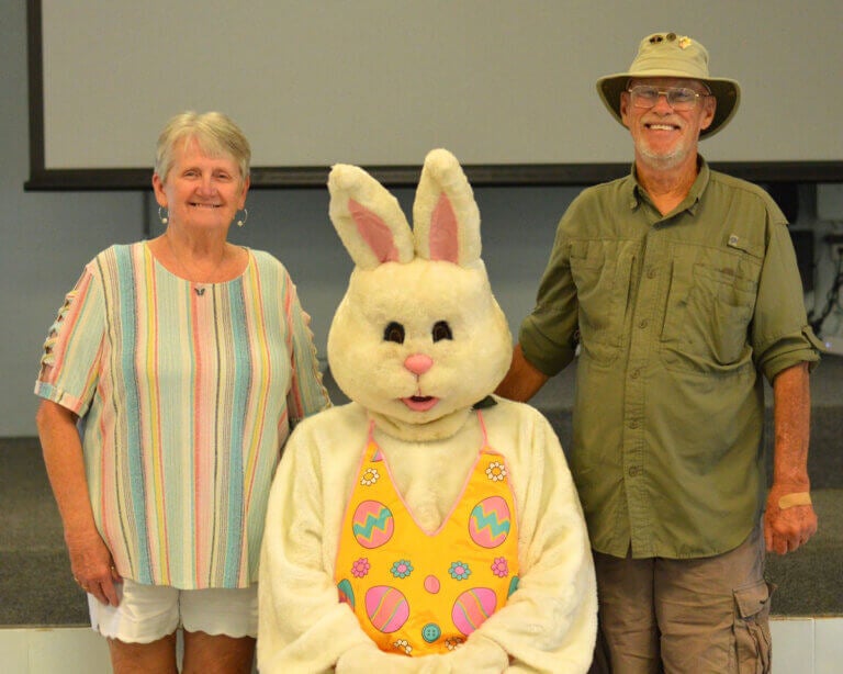 Residents at Oak Harbor RV Park in Haines City, Florida, with the Easter Bunny during an event in the Clubhouse.