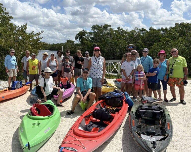 Guests at River Vista RV Park in Ruskin, Florida pose together before a canoe trip