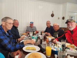 Camelot East staff and residents at a Veterans luncheon in Sarasota, Florida