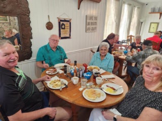 Camelot East staff and residents at a Veterans luncheon in Sarasota, Florida