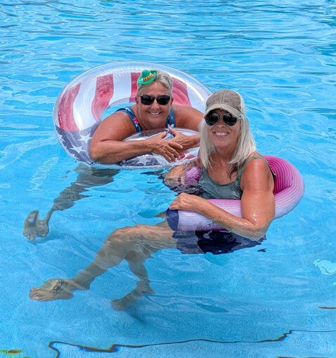 Residents swimming in the pool during the Cinco de Mayo celebration at Cypress Lakes Village in Lakeland, FL.