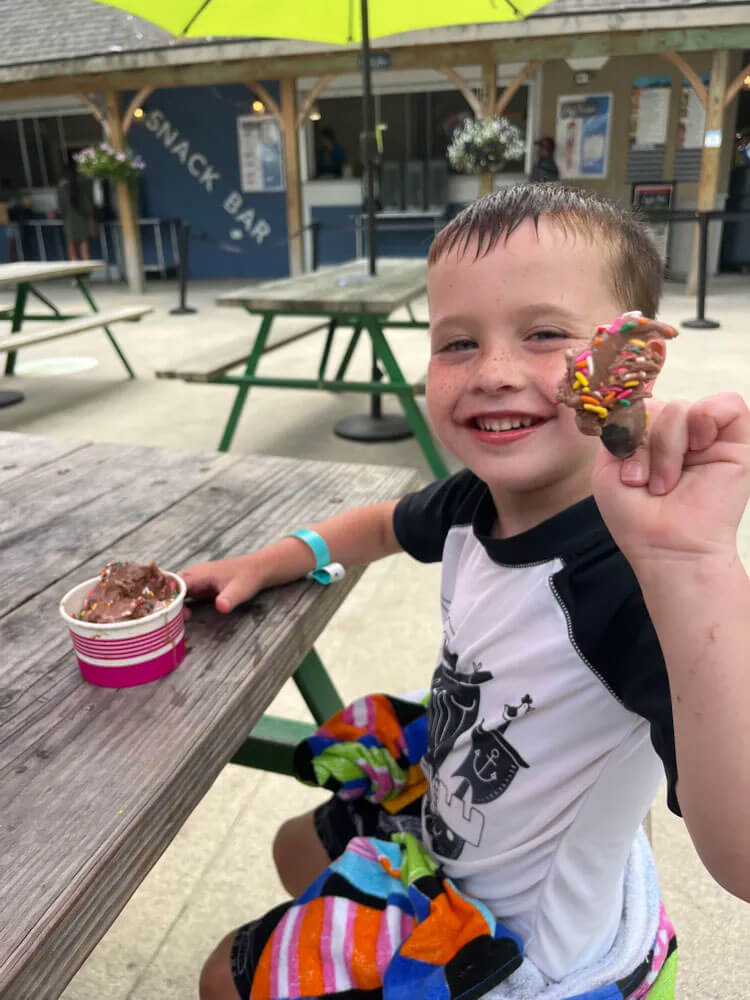 Kid eating ice cream at the Point Sebago Snack Bar