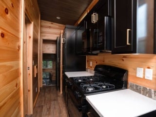 A kitchen inside of a lake cabin at Point Sebago Resort in Casco, Maine.