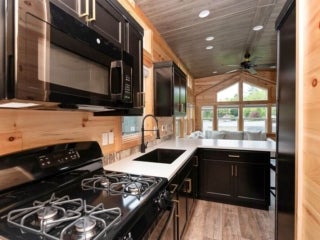 A kitchen inside of a lake cabin at Point Sebago Resort in Casco, Maine.