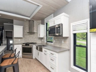 Inside the kitchen of a park model cabin at Point Sebago Resort in Casco, Maine.