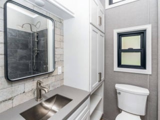 Inside the bathroom of a park model cabin at Point Sebago Resort.