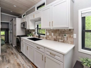 A kitchen inside of a lake cabin at Point Sebago Resort in Casco, Maine.