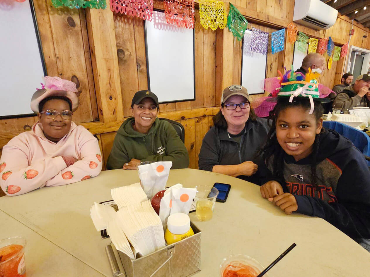 Opening_Weekend_PSR Guests wearing colorful hats on Derby Day at Point Sebago Resort