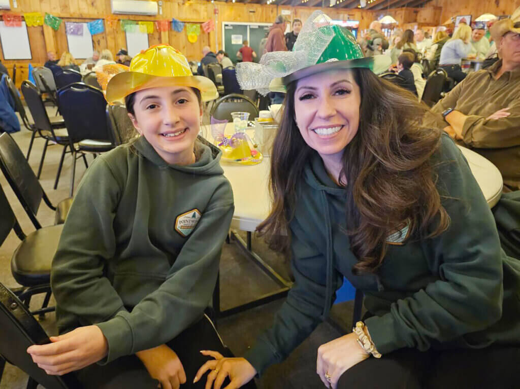 Opening_Weekend_PSR( Guests wearing colorful hats on Derby Day at Point Sebago Resort