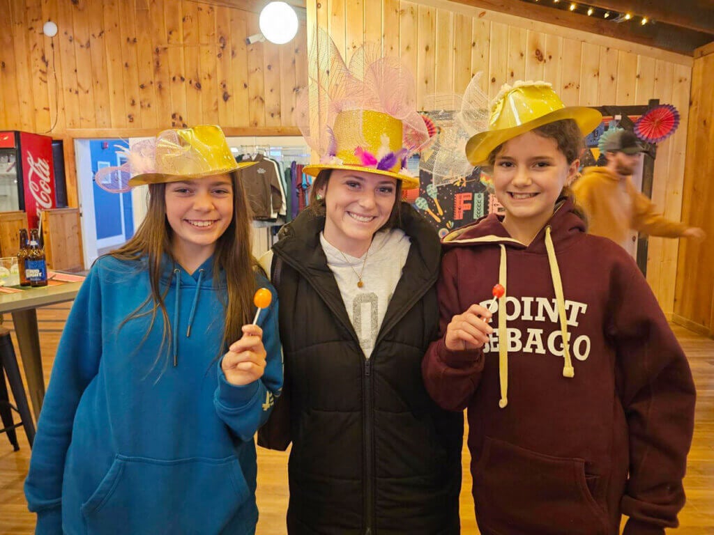 Opening_Weekend_PSR_1 Guests wearing colorful hats on Derby Day at Point Sebago Resort