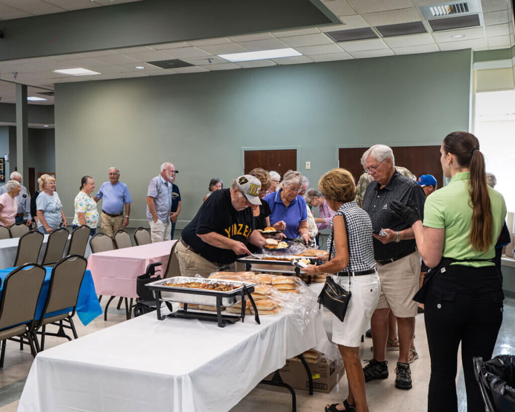 Residents lined up for food at the Resident Picnic in Cypress Lakes Village in Lakeland, Florida.