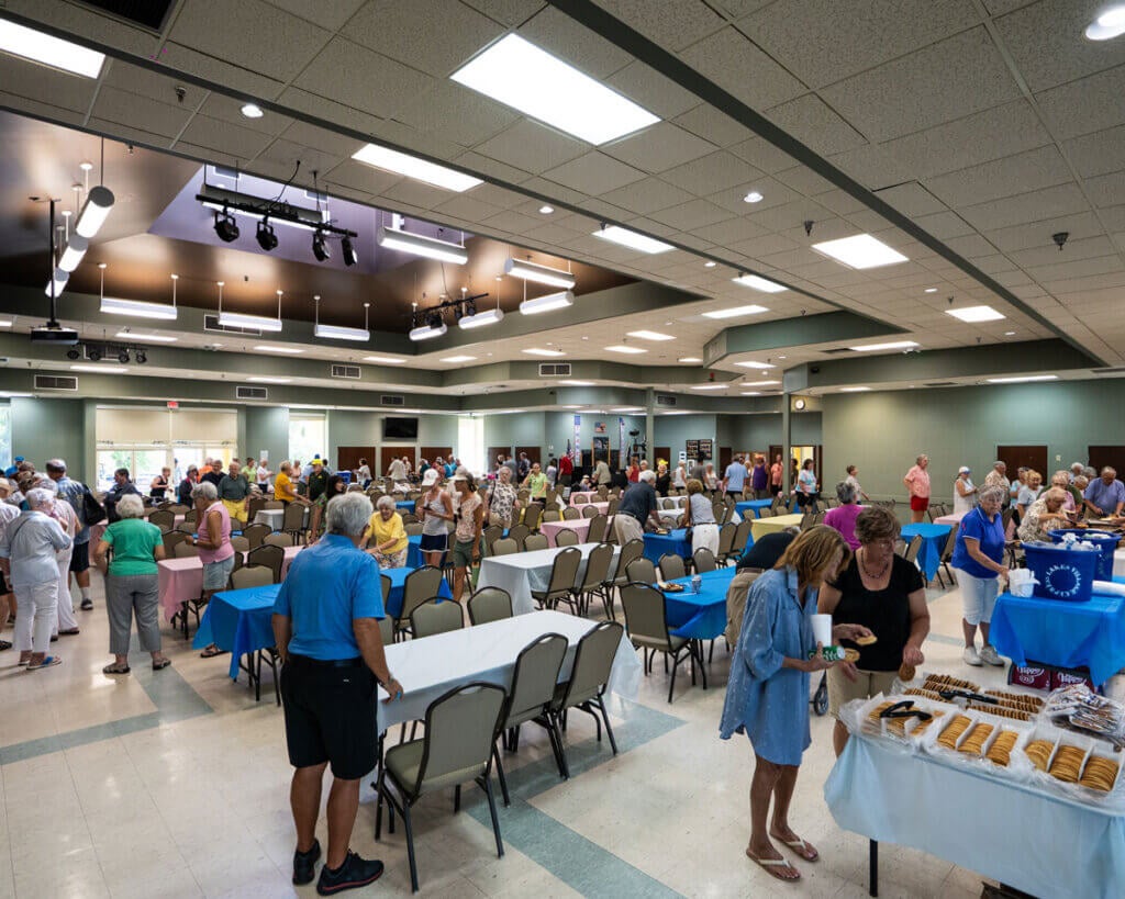 Residents heading into the Clubhouse for the Resident Picnic in Cypress Lakes Village in Lakeland, Florida.