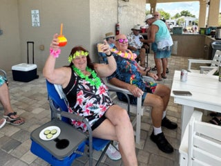 Residents enjoying the Luau Pool Party at The Meadows in Tarpon Springs, Florida