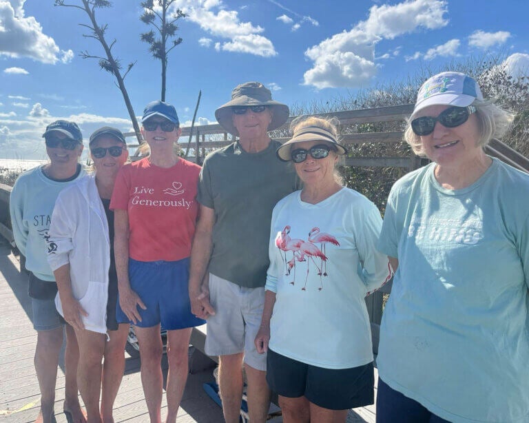 Residents at The Waters in Melbourne Beach, Florida cleaning up the beach for Earth Day
